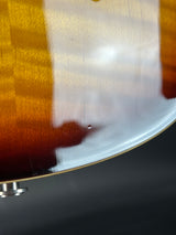Close-up of a guitar on a dark background