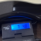 Used 2018 PRS Silversky Onyx on scale displaying weight.