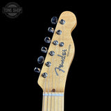 Fender Telecaster guitar headstock on a black background