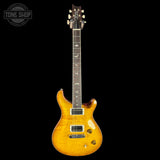 Electric guitar with a sunburst finish on a black background, featuring the Tone Shop logo.
