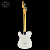 White electric guitar with a black pickguard on a white background, featuring 'Tone Shop' branding.
