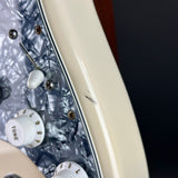 Wear on side of Used 1999 Fender Standard Stratocaster White.