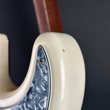 Wear on horn of Used 1999 Fender Standard Stratocaster White.