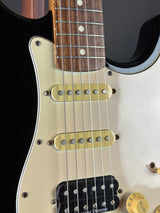 Close-up of a guitar with a focus on the neck and body