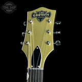 Gretsch guitar headstock with 130th anniversary logo on a black background