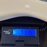 Used 1999 Fender Standard Stratocaster White on scale displaying weight.
