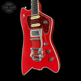 Red electric guitar with a black background, featuring the Tone Shop logo.