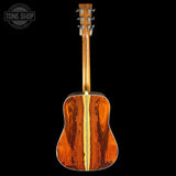 Wooden acoustic guitar on a black background with 'Tone Shop' logo.