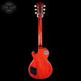 Red electric guitar on a black background with 'Tone Shop' logo.