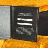 Gibson Custom Certificate of Authenticity on a textured surface