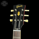 Gibson guitar headstock with brand logo on a black background