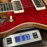 PRS Select Wood Library McCarty 594 Trem 10 Top Red Tiger on scale displaying weight.