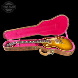 Gibson Les Paul guitar in a pink-lined case with 'Tone Shop' logo.