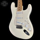 Cream-colored electric guitar with a maple neck, featuring a white pickguard, chrome hardware, and a black pickguard, shown against a solid black background with a Tone Shop watermark in the top left corner.