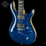 Front angle of Used Kiesel CT624M Blue Quilt Top Black Limba.