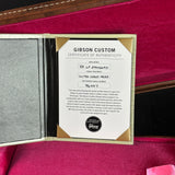 Gibson Custom certificate of authenticity on a red background