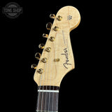 Fender Stratocaster guitar headstock on a black background