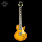 Gibson electric guitar with a sunburst finish on a black background
