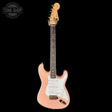 Pink electric guitar with a white pickguard on a black background, featuring 'Tone Shop' logo.