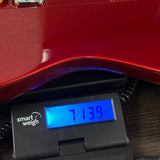 Used 2026 Fender 75th Anniversary Cabronita American Pro Telecaster Candy Apple Red on scale displaying weight.