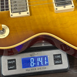 Guitar on a digital scale displaying weight