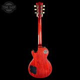 Red electric guitar on a black background with 'Tone Shop' logo.