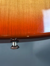 Wooden door with a metallic doorknob on a gradient background
