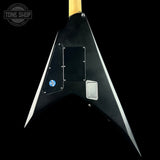 Black electric guitar body with visible brand logo on a black background