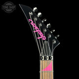 Guitar headstock with 'Jackson' branding on a black background