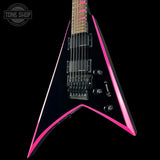 Black and pink electric guitar with 'Tone Shop' logo in the corner.