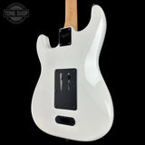 White electric guitar body with visible branding on a black background