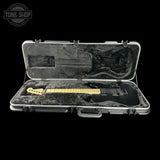 Guitar case with a guitar model inside, featuring 'Tone Shop' branding.