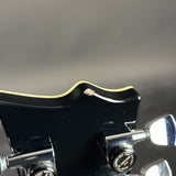 Chip on headstock of Used ESP Original Series Eclipse Silver Liquid Metal Burst.