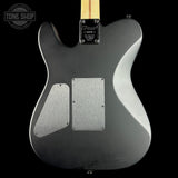 Back view of a silver electric guitar with 'Tone Shop' logo.