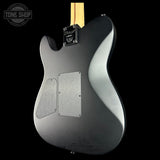 Guitar body with a 'Tone Shop' logo in the corner