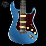 A blue electric guitar with a dark red pickguard and cream pickups, shown against a black background with a Tone Shop watermark in the top left corner.