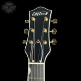 Gretsch guitar headstock on a black background