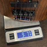 Bass guitar on a digital scale displaying weight