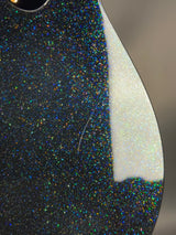 Close-up of a textured surface with glittery black and white pattern