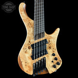 Wooden electric guitar with a black background, featuring the Tone Shop logo.