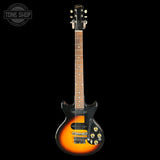 Electric guitar with a sunburst finish on a black background, featuring the Tone Shop logo.