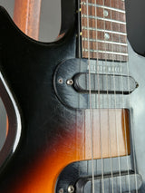 Close-up of a electric guitar with a sunburst finish