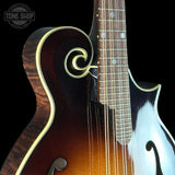 Close-up of a mandolin with a black background