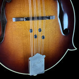 Close-up of a Gibson mandolin on a black background