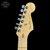Guitar headstock with Fender logo on a black background