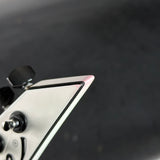 Close-up of a metallic object with a dark background