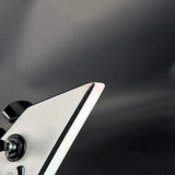 Close-up of a metallic object with a blurred dark background