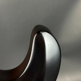 Close-up of a metallic object with a blurred gray background