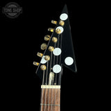 Guitar headstock with tuning pegs on a black background, featuring 'Tone Shop' logo.
