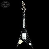 Black electric guitar with white polka dot design on a black background, featuring 'Tone Shop' logo.